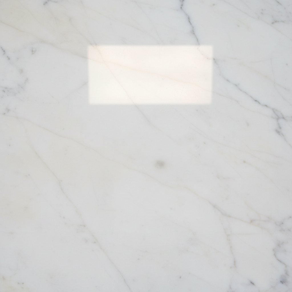 A close-up, professional photograph showcasing a perfectly restored, gleaming marble surface. The area where a significant stain was previously located is now impeccably clean, smooth, and highly reflective, appearing as good as new. The image emphasizes the marble's natural luster and the absence of any residue or discoloration, symbolizing successful stain removal and restoration. Soft, bright lighting enhances the pristine finish.